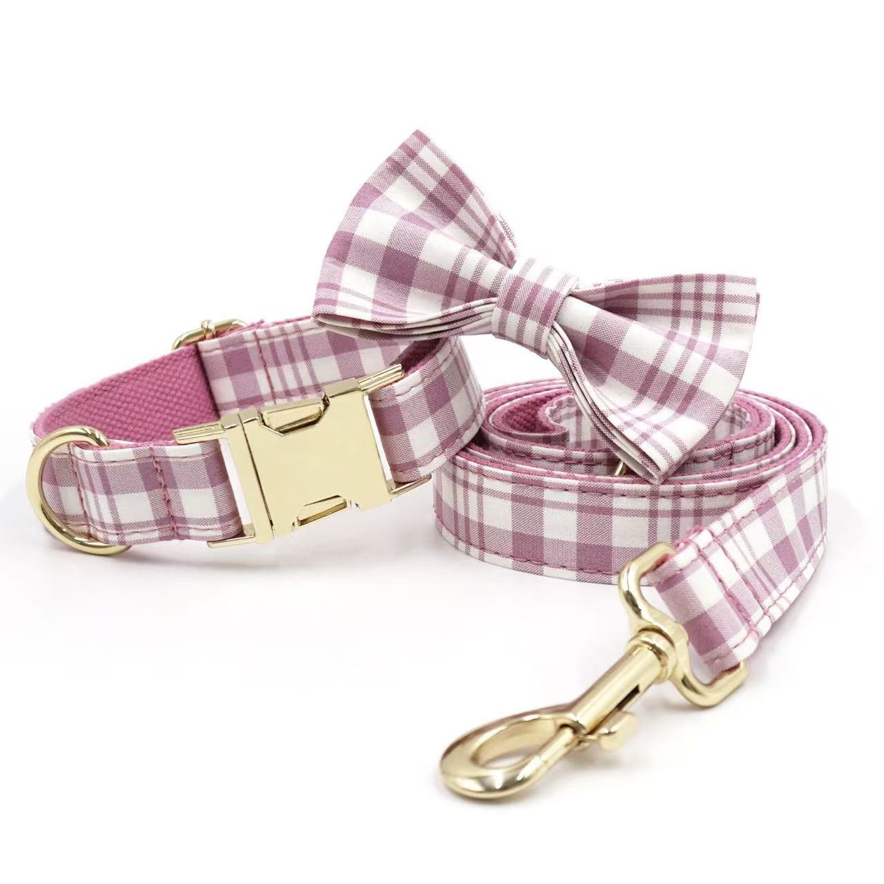 Pink plaid pet collar with matching bow tie and leash, gold buckle.