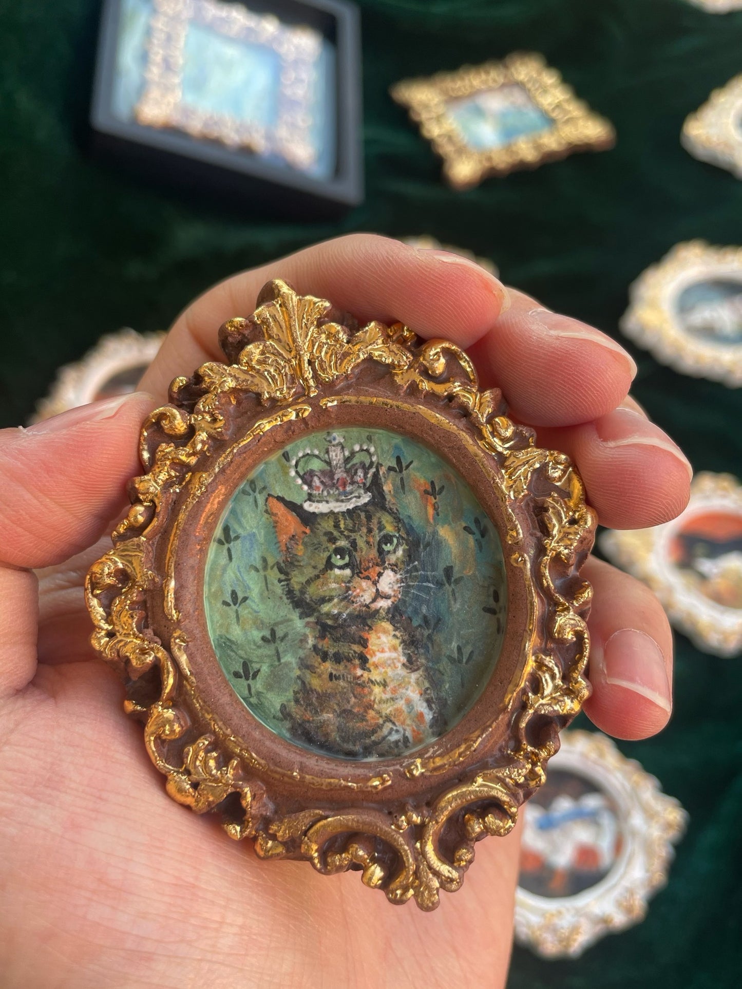 Round brown ceramic magnet on display stand, depicting oil painting