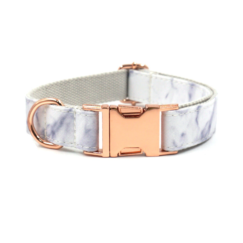 White marble patterned pet collar with rose gold metal buckle and D-ring.