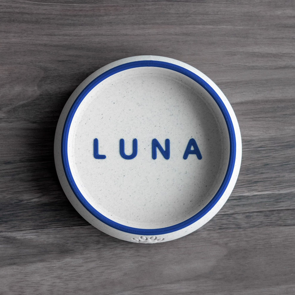 White PLA pet bowl with royal blue rim and name “LUNA”