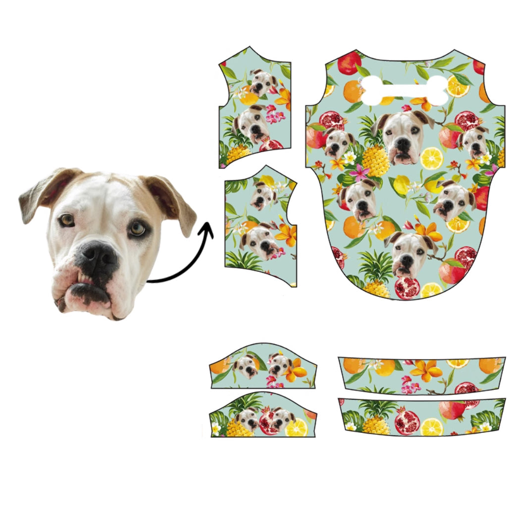 Bulldog face pattern with pineapples, lemons, and pomegranates on light green tropical background