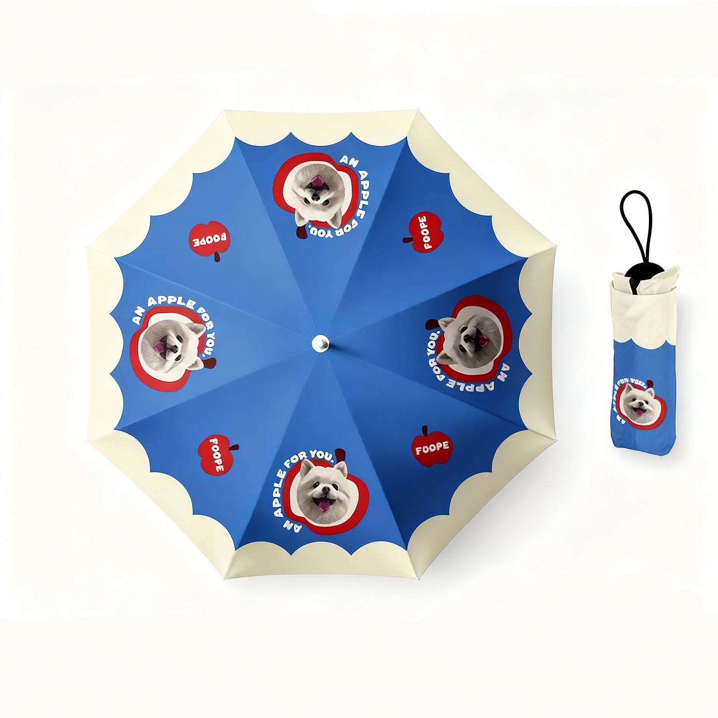 Blue umbrella printed with dog portraits and red apple graphics, includes matching pouch.