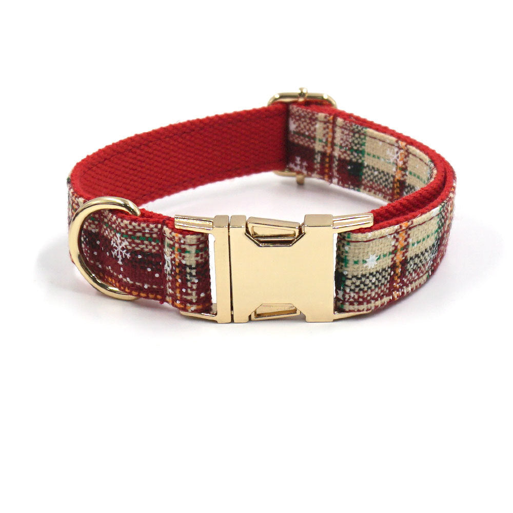 Beige and red plaid pet collar with gold buckle and red inner layer.