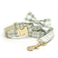 Light green plaid pet collar with bow tie and leash, gold metal hardware.