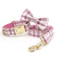 Pink plaid pet collar with matching bow tie and leash, gold buckle.