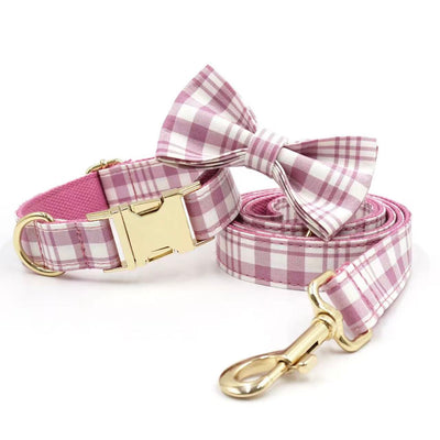 Pink plaid pet collar with matching bow tie and leash, gold buckle.