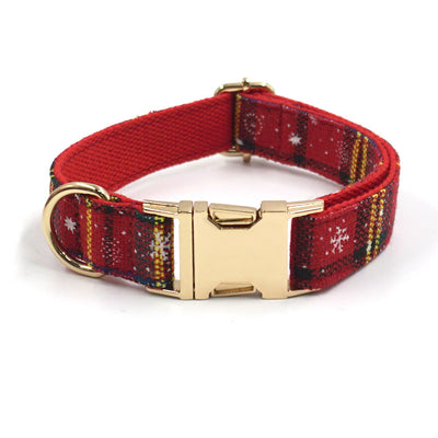 Red plaid dog collar with golden buckle and matching fabric.