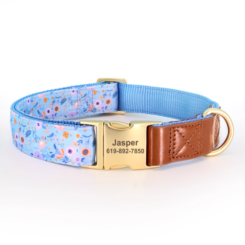 Blue floral print dog collar with personalized engraved buckle and brown webbing.