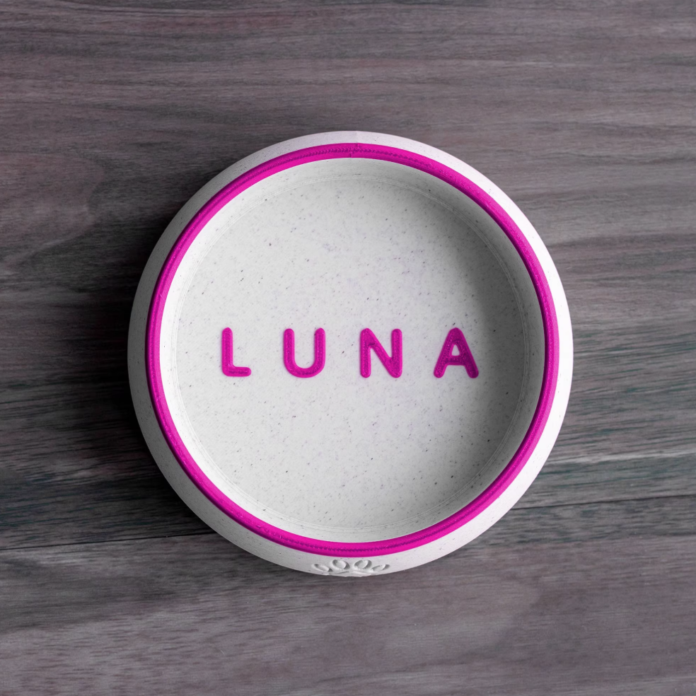 White PLA pet bowl with magenta rim and name “LUNA”