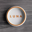 White PLA pet bowl with orange rim and engraved name “LUNA”