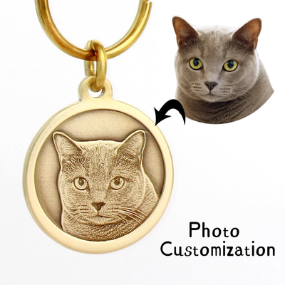 Photo-customized brass tag engraved with detailed cat face, round design.