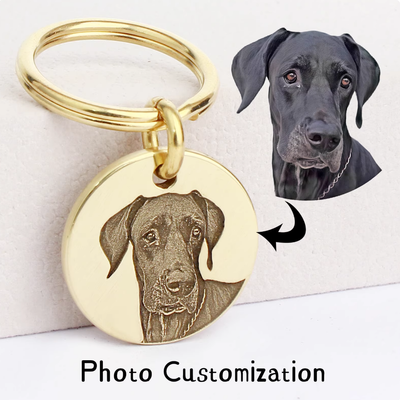 Custom brass pet tag engraved with 3D relief portrait of a black dog, photo customization example.