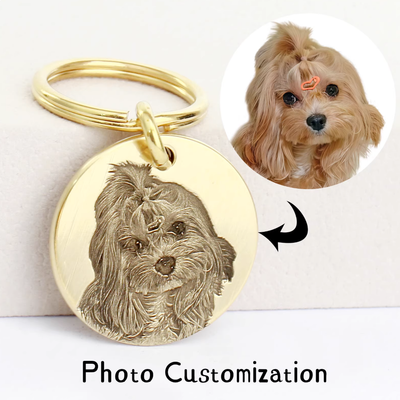 Personalized brass dog tag engraved from photo of small fluffy dog with top knot.