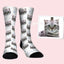 Custom pet face socks featuring a gray tabby cat with blue heart and doodle pattern background