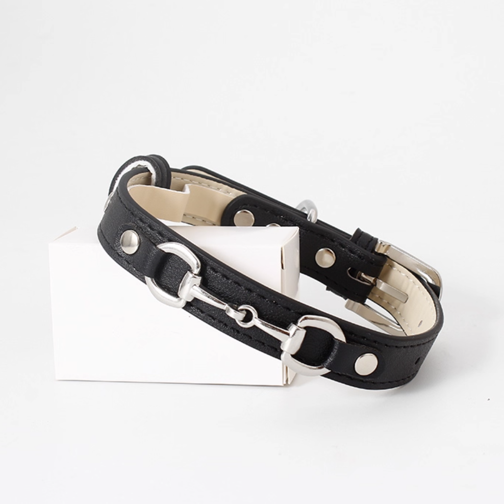 Black horsebit style leather dog collar with metal bit detail