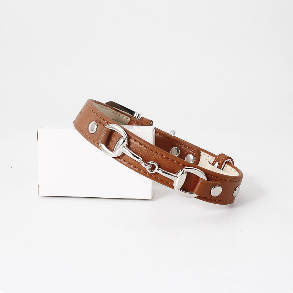Brown leather dog collar with horsebit metal detail