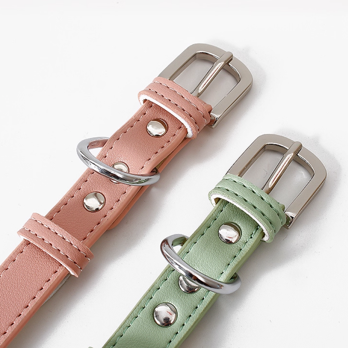 Close up of dog collar buckle and stitching detail in pink and green