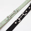 Side by side close up of mint green and black horsebit style dog collars