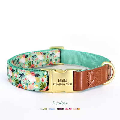 Collection of five floral dog collars in green, orange, blue, pink, and black with engraved metal buckles.