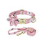 Pink daisy floral dog collar and leash set with matching flower bow and gold hardware.
