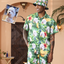 Personalized tropical Hawaiian shirt with dog face and banana leaf floral print, paired with matching shorts and bucket hat.