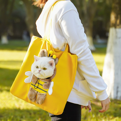 Yellow tote bag with bee costume opening showing cat’s head