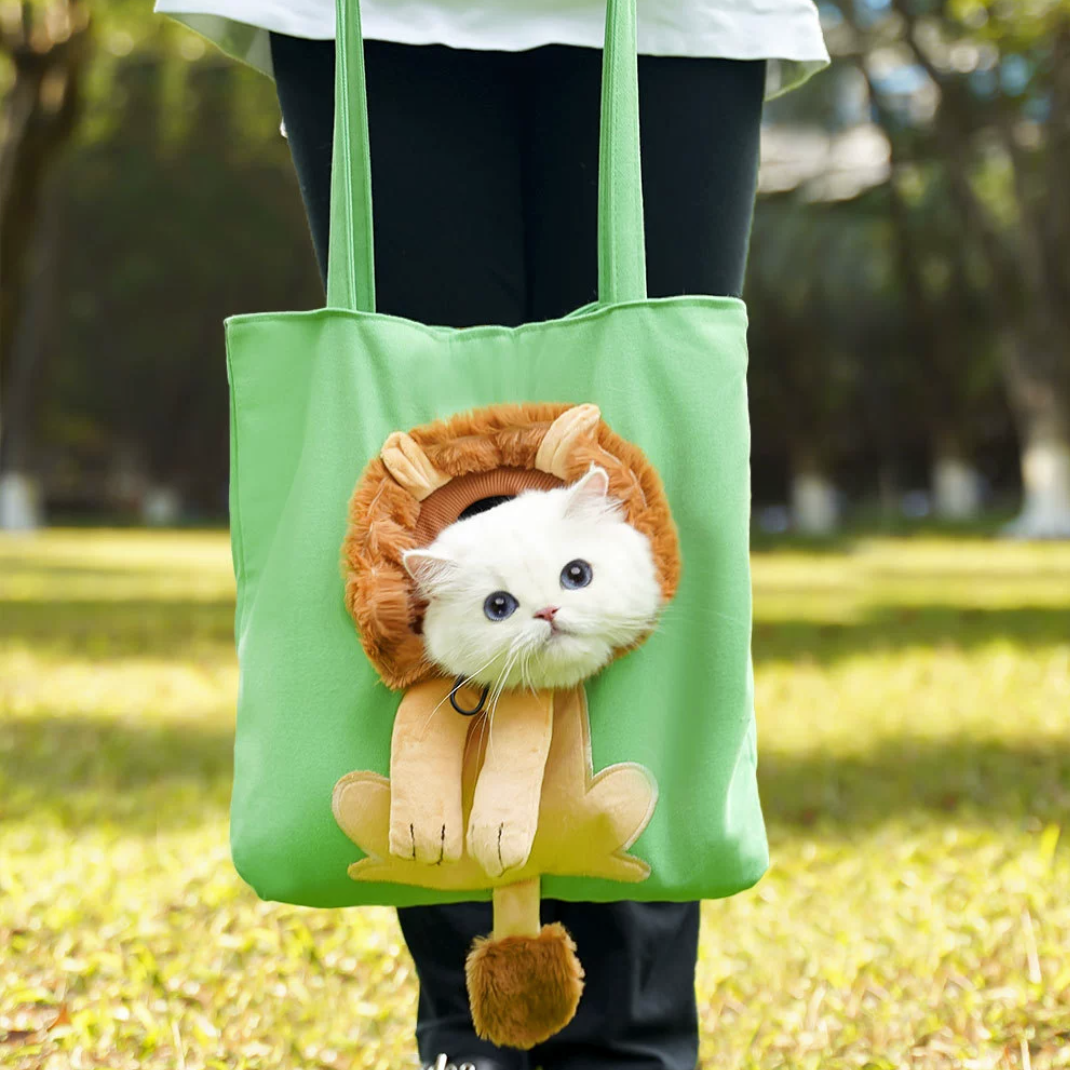 Green tote with lion mane front, cat’s head peeking out