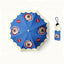 Blue umbrella printed with dog portraits and red apple graphics, includes matching pouch.
