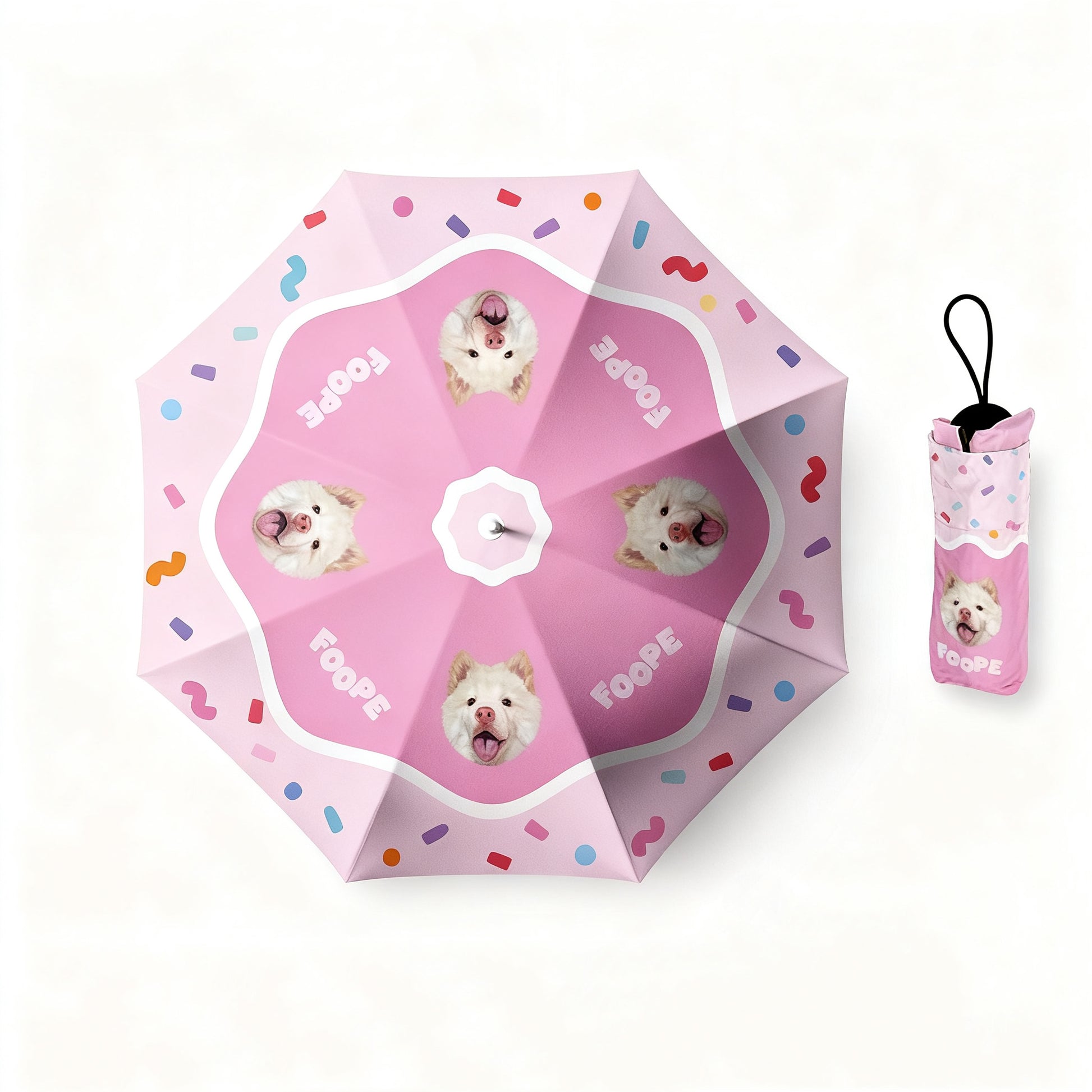 Pink umbrella with white dog portraits, confetti pattern, and matching carry pouch.